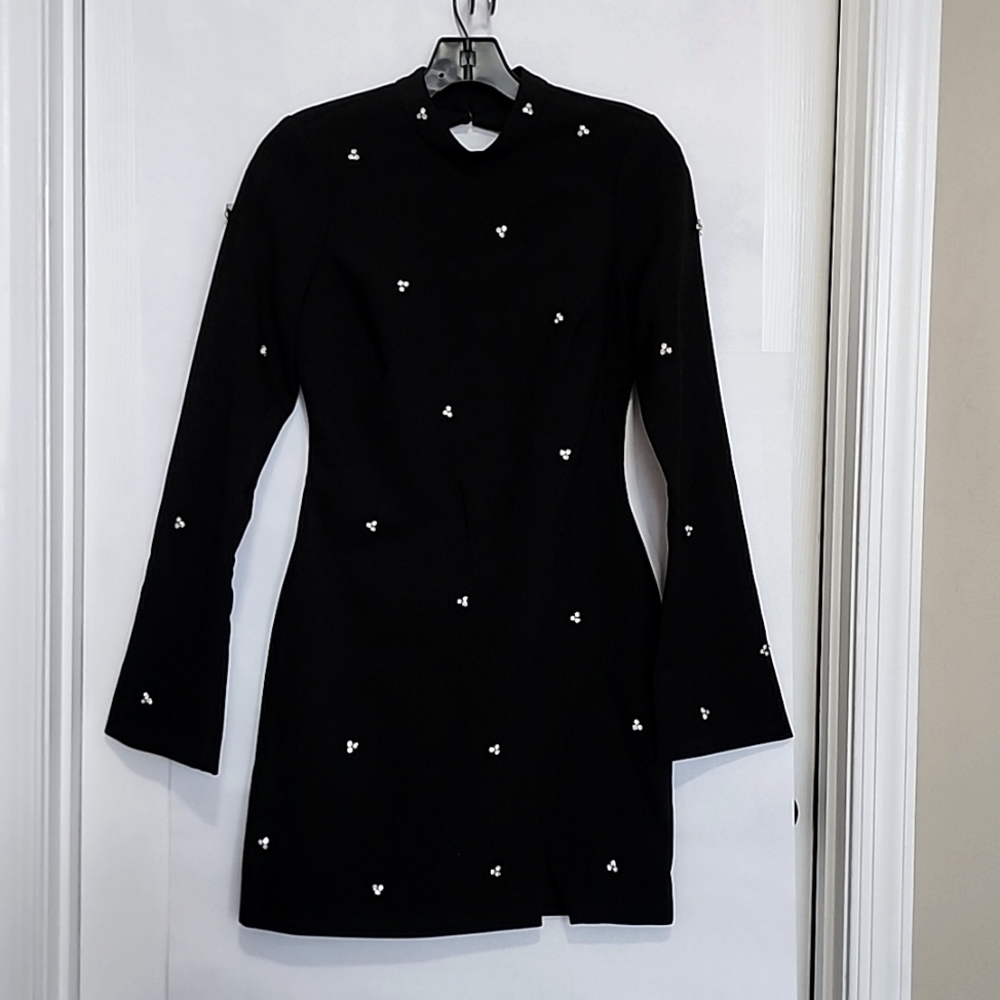 Black cocktail dress with rhinestone. Made by Likely, size 4.